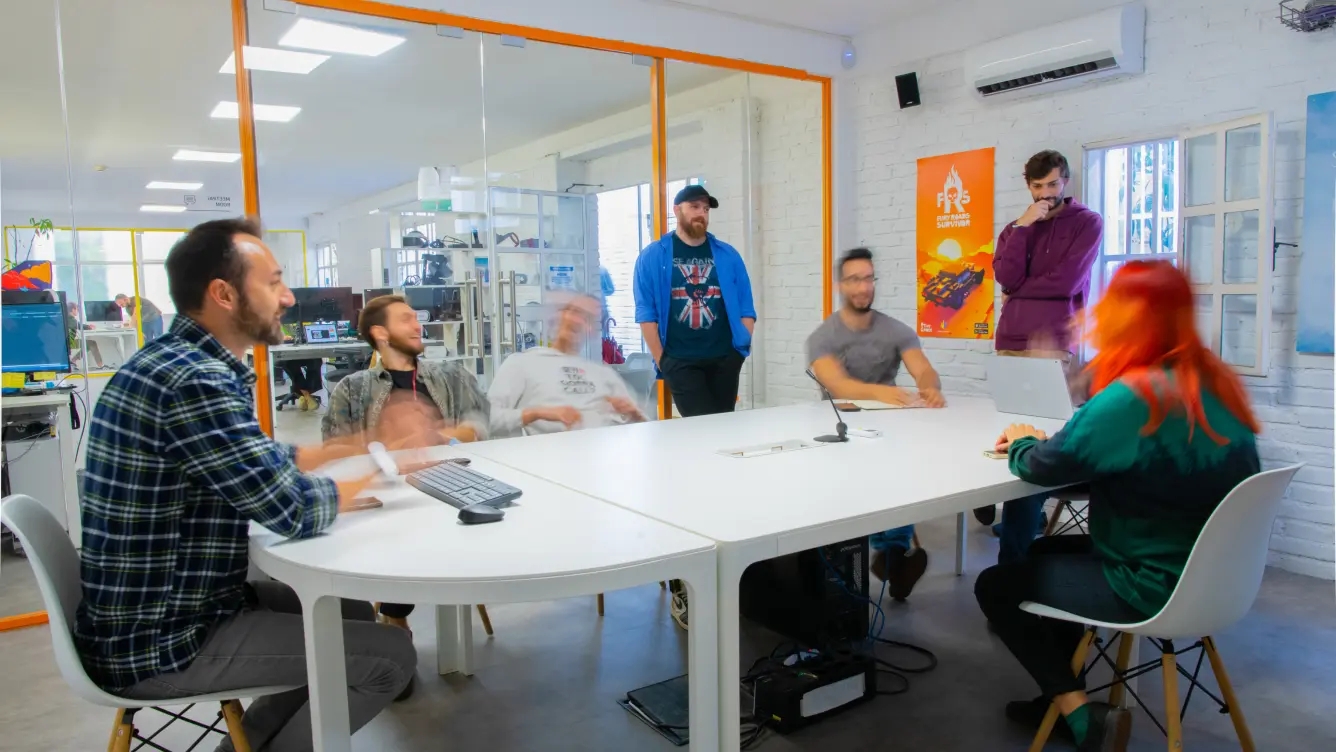 Centounopercento's team at work in the meeting room 