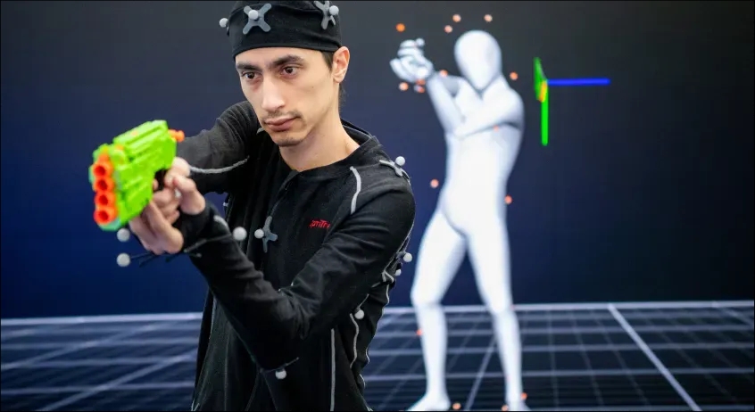 Man using Motion Capture with fake green gun